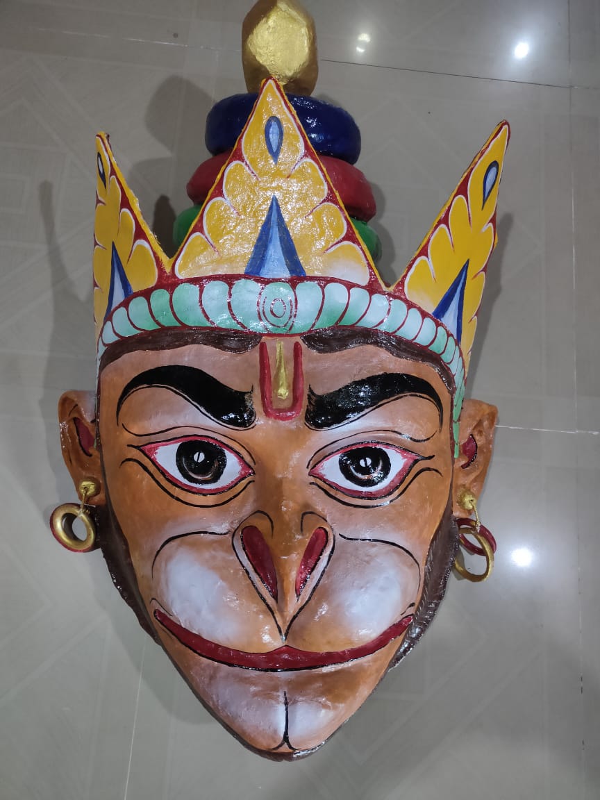 Hand-painted Hanuman mask with a golden crown, earrings, and a white muzzle